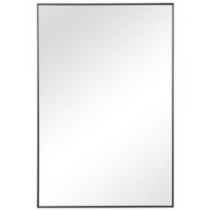 a large mirror on a white wall with a black frame and metal trim around the edges