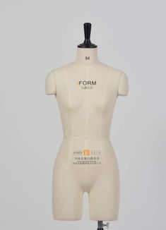 a white mannequin with the word form printed on it's chest and back