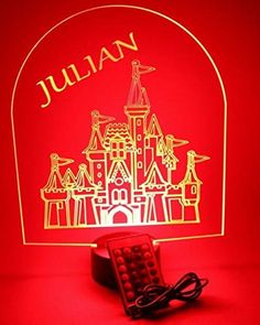 a red light with a castle on it and the name julian written in gold lettering