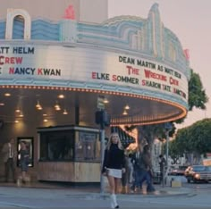 people are standing in front of the marquee