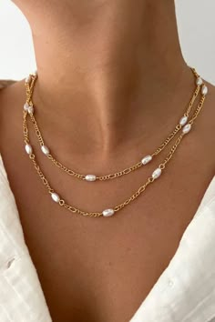 small pearls on a gold chain necklace. Great layering necklace that is simple and modern for everyday wear. It can go with so many outfits, day to night. Trendy 16 Inch Jewelry Gift, Elegant Pearl Chain Layered Choker Necklace, Elegant Double Strand Adjustable Necklaces, Elegant Double Strand Adjustable Necklace, Multi-strand Gold Pearl Chain Jewelry, Gold Multi-strand Pearl Chain Jewelry, Elegant Adjustable Double Strand Necklaces, Elegant Multi-strand Pearl Necklace, Elegant Adjustable Double Strand Necklace