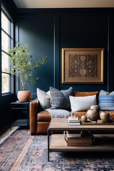 a living room filled with furniture and a painting on the wall above it's coffee table