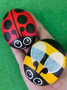 two painted rocks in the shape of ladybugs