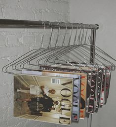 a magazine rack with magazines hanging from it