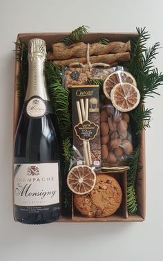 a bottle of champagne and cookies in a box