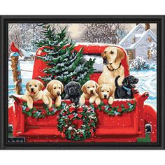 a group of dogs sitting in the back of a red truck with christmas wreaths on it