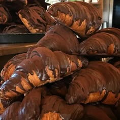 chocolate covered pastries stacked on top of each other