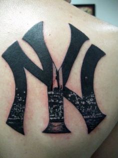 the new york yankees logo is shown on this tattoo