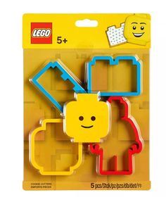 three lego cookie cutters with different shapes and designs on the front, one has a smiling face