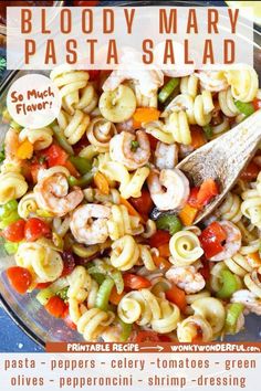 a bowl filled with pasta and shrimp on top of a table