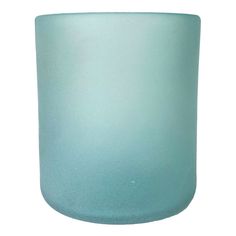 a light blue glass vase sitting on top of a white table next to a wall