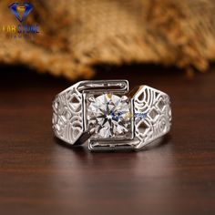 a white gold ring with an intricate design