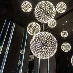 several circular lights hanging from the ceiling in a building