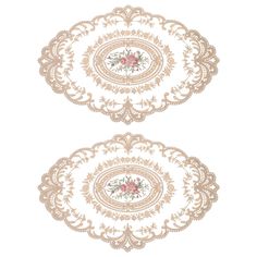 two plates with floral designs on them, one in gold and the other in white