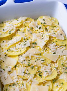 a casserole dish with cheese and herbs