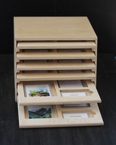 a stack of books sitting on top of a wooden table