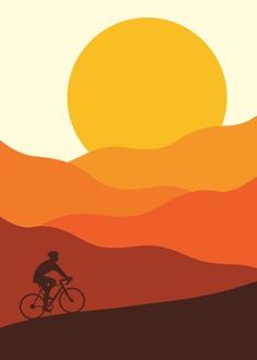 a man riding a bike across a field under a sun setting in the sky over mountains