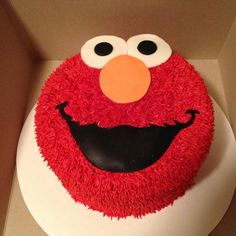 the cake is decorated like an elmo face