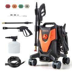 an orange and black pressure washer with accessories