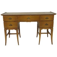 an antique desk with two drawers on each side