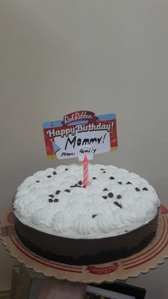 a birthday cake with white frosting and chocolate sprinkles