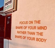 a sign that reads focus on the shape of your mind rather than the shape of your body