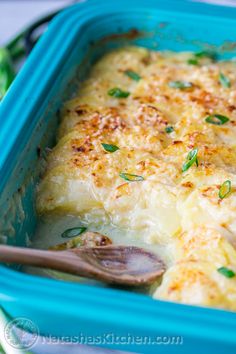 a casserole dish with cheese and herbs in it, ready to be eaten