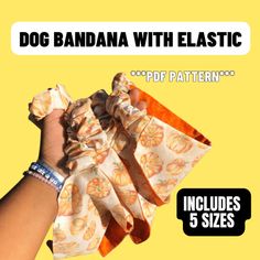 a hand holding up a bow with the words dog bandana with elastic