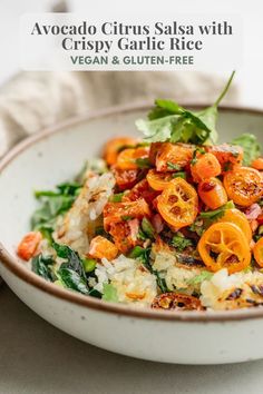 a white bowl filled with vegetables on top of a table