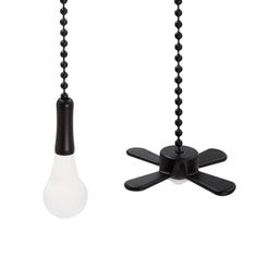 two black and white light bulbs hanging from chains on a string, one is turned upside down