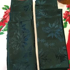 two pieces of green cloth with flowers on them