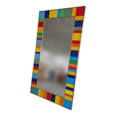 a multicolored mirror is shown against a white background