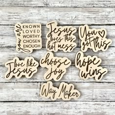 six wooden magnets with words on them, one saying jesus loves the lord and two saying