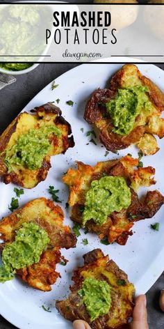 smashed potatoes topped with guacamole on a white plate