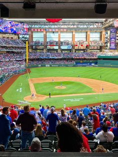 a baseball stadium filled with lots of people