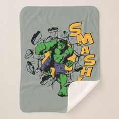 a blanket with the hulk smash logo on it and an image of a man holding a fist