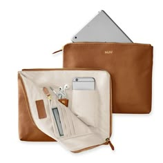 The best gifts are always the ones that make your life infinitely easier - like this beautiful leather clutch that doubles as a super-functional tech organizer. The zip-around closure opens to reveal multiple interior open and zipped pockets, leather tabs, card slots and plenty of space for your phone, keys, cards, cash, chargers, and other daily essentials. Add a foil debossed monogram for a personal touch.    11"w x 1"d x 9"h  Leather or suede exterior with a grosgrain lining.  See Product Inf Leather Gifts For Home, Bag For Mac, Travel Makeup Bag Leather, Modern Desk Accessories Leather, Leather Handbags Women Travel, Leather Sewing Accessories, Leather Art Supplies Bag, Gifts To Sew For Travelers, Gifts For Woman Who Travel