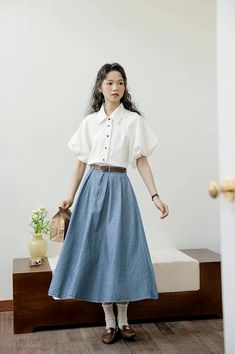 Add a touch of vintage and retro vibe to your outfit. This midi length denim skirt has a button and zip up front, pleats, side pockets, belt loops and elastic back. 24"-34" waist, 30" length October Concert Outfit, Light Denim Skirt Outfit, Pleat Skirt Outfit, Pleated Midi Skirt Outfit, Denim Pleated Skirt, American Couple, Pleated Skirt Outfit, Pleated Denim, Inspiration Designs