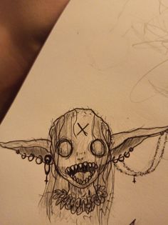 a drawing of a skull with wings on it's head and an evil face