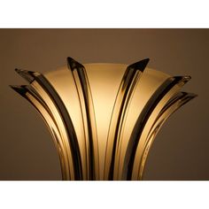 an art deco lamp with curved glass shades