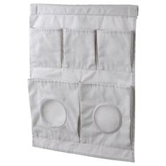 an over the door hanging organizer with three pockets and two circles on each one side