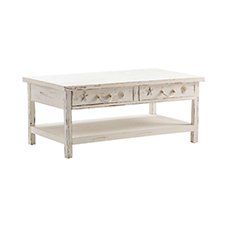 a white coffee table with drawers on top