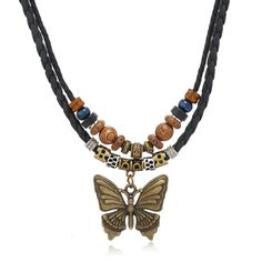 PRICES MAY VARY. Elegant and Fashionable Design: The necklace has a layered design, adding a wooden bead necklace on top of the butterfly charm, which makes the necklace more fashionable at the same time of elegance, and it can bring you a kind of elegant and unique fashionable atmosphere in any occasions. Quality Material: The hippie necklace is made of high quality alloy and high quality leather, sturdy and durable, nickel and lead free. The outer layer of the necklace is made of waxed rope, w Hippie Choker Necklace, Boho Pendant Necklace, Wooden Bead Necklaces, Braided Necklace, Versatile Jewelry, Hippie Necklace, Boho Pendant, Pretty Jewelry, Layered Design