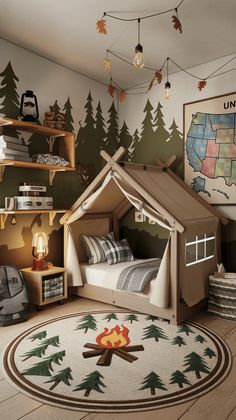 a child's bedroom with a teepee tent bed in the middle and trees on the wall