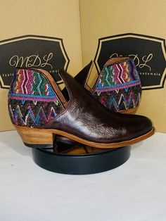 Booties handmade 100% leather design of huipil indigenous of Guatemala Color: Brown Size: 8 If you want to see more products and more styles you can visit our website www.mdltypicalfashion.com leather sole and rubber heel heel height 2″  Thick heel Almond tip Side v cut Clasp poke Handmade Western Boots, Bohemian Brown Ankle-high Boots, Handmade Bohemian Leather Boots, Traditional Multicolor Leather Boots, Brown Slip-on Festival Boots, Bohemian Leather Slip-on Boots, Traditional Brown Closed Toe Boots, Bohemian Brown Closed Toe Boots, Brown Bohemian Closed Toe Boots