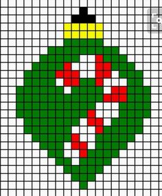 a cross stitch christmas ornament in green, red and yellow