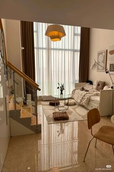 a living room filled with furniture next to a stair case