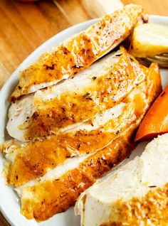 chicken, carrots and potatoes on a white plate