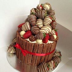 there is a chocolate cake with strawberries on top