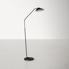 a black floor lamp sitting on top of a table